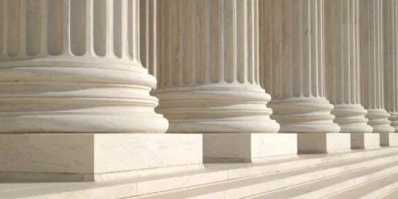 A row of columns in front of a building